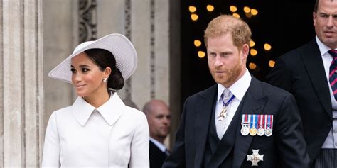 Meghan looks chic in ivory Dior coat dress as she arrives at 